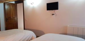Postel nebo postele na pokoji v ubytování La Casina de Marina de Tresgrandas