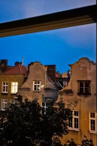 a view of an old building from a window at Baltic Gdansk OLD TOWN in Gdańsk