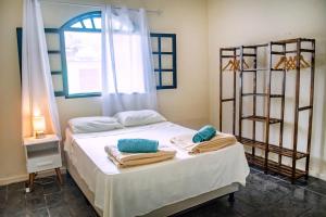 Postel nebo postele na pokoji v ubytování Casa Surya Paraty