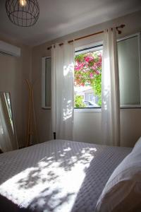 Postel nebo postele na pokoji v ubytování Casa da Bugainvillea