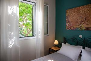 Postel nebo postele na pokoji v ubytování Casa da Bugainvillea
