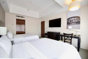 Postel nebo postele na pokoji v ubytování Hotel Plaza Génova Centro