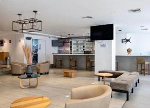 TV a/nebo společenská místnost v ubytování Hotel Plaza Génova Centro