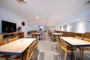 TV a/nebo společenská místnost v ubytování Hotel Plaza Génova Centro