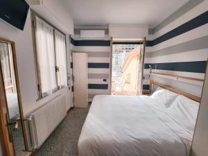 A bed or beds in a room at Residence Corallo