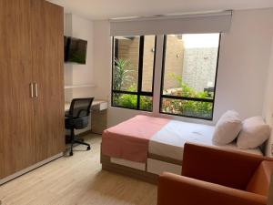 TV a/nebo společenská místnost v ubytování Apartahotel Connect Bogotá