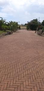 a brick walkway in the middle of a park at Villa Sorrentina in Alghero