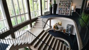 an overhead view of a staircase in a building with windows at Parkhotel Cloppenburg in Cloppenburg