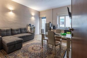 a living room with a couch and a table at San vito 9 - a in Agrigento