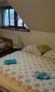 Postel nebo postele na pokoji v ubytování Guest House Vila Frýdštejn