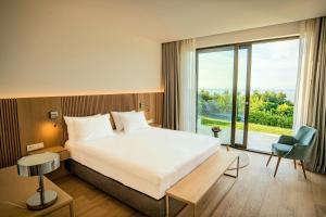 Postel nebo postele na pokoji v ubytování Sól by Privé - Boutique Hotel - Kepi i Rodonit