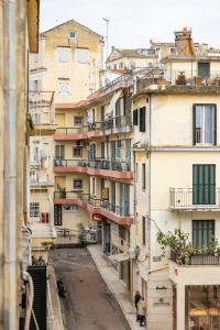 a view of an alley between buildings at Corfu Downtown in Corfu Town