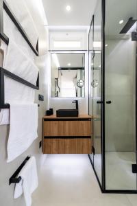 a bathroom with a sink and a shower at Apartamerica 341 LujoVista Mar in Playa de las Americas