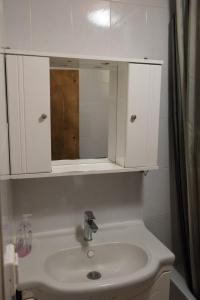 a bathroom with a sink and a mirror at Garden Villa in Stavros