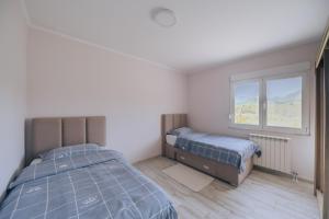Ένα ή περισσότερα κρεβάτια σε δωμάτιο στο Apartment Majstorina