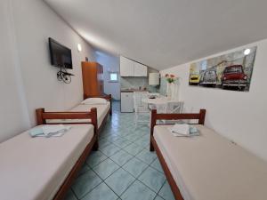 Kuchyň nebo kuchyňský kout v ubytování Pool Apartments Knežević