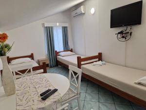 Postel nebo postele na pokoji v ubytování Pool Apartments Knežević