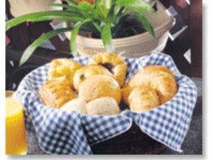 a bowl of pastries on a table with a plant at Kumegawa Wing Hotel - Vacation STAY 63081v in Higashi-murayama +4 photos