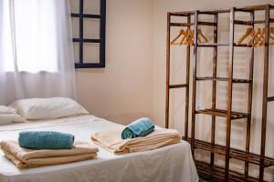Postel nebo postele na pokoji v ubytování Casa Surya Paraty