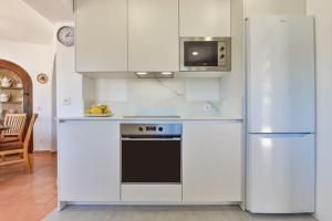 Küche/Küchenzeile in der Unterkunft Villas Guzman - Flores