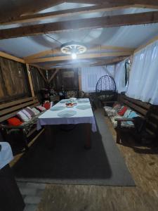 a room with a table and chairs in a tent at Dariaus ir Gireno 7 in Zarasai
