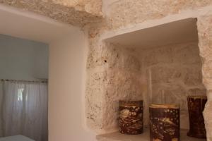 Koupelna v ubytování Trullo Il Melograno + 37 fotografií