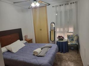 a bedroom with a bed with two pillows on it at VAO Holiday Rentals-Santiago De la Ribera in San Javier