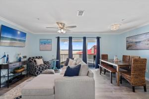 a living room with a couch and a table at Sunset Harbor Unit 422 in Navarre