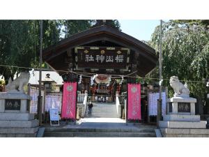 a temple with pink signs in front of it at KITA HOTEL - Vacation STAY 69754v in Morioka