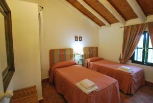 Posteľ alebo postele v izbe v ubytovaní Finca La Vicaria AGUADULCE