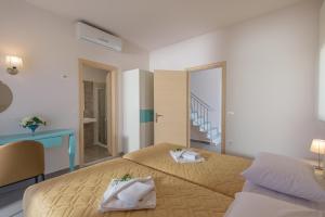 Postel nebo postele na pokoji v ubytování Koukos Villas