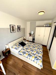 a bedroom with a large bed in a room at Studio Apartman LEMON in Dubrovnik