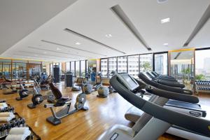 a gym with a bunch of treadmills and ellipticals at Mandarin Oriental, Jakarta in Jakarta