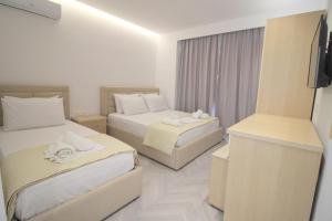 Cama ou camas em um quarto em Noa Boutique Hotel