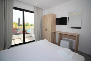 Cama ou camas em um quarto em Noa Boutique Hotel