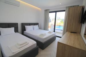 Cama ou camas em um quarto em Noa Boutique Hotel