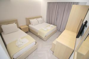 Cama ou camas em um quarto em Noa Boutique Hotel