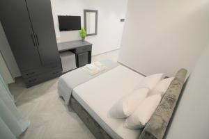 Cama ou camas em um quarto em Noa Boutique Hotel