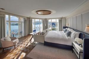 a large bedroom with a large bed and windows at Mandarin Oriental Palace, Luzern in Lucerne +76 photos