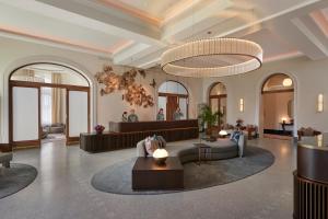 a lobby of a hotel with a waiting room at Mandarin Oriental Palace, Luzern in Luzern