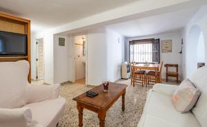 a living room with a couch and a table at La Piriposa in Chilches