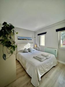 Postel nebo postele na pokoji v ubytování Charmoso estúdio perto da praia