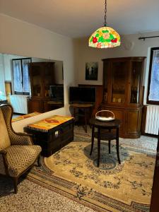 a living room with a couch and a table at Canton Pasquera in Agrano