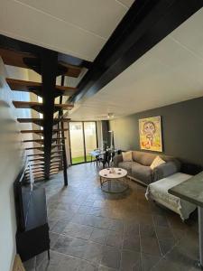 a living room with a couch and a table at 2 Bedroom Urban Bliss in Windhoek