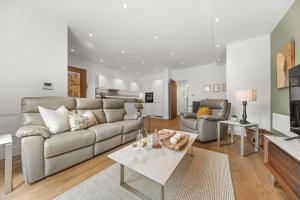 a living room with a couch and a table at Springfield Fourteen in Harrogate