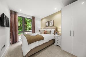 a bedroom with a large bed and a window at Springfield Fourteen in Harrogate