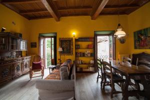 a living room with a table and a dining room at All'Antico Convento in Cannero Riviera