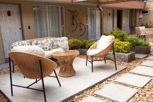 a patio with two chairs and a couch at Marbore hotel & Spa in Bogotá