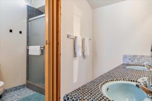 a bathroom with a sink and a shower at The Bodega House - New Rental Near Salmon Creek in Bodega Bay +32 photos