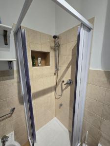 a shower with a glass door in a bathroom at Destinazione Mare Naxos in Giardini Naxos +14 photos